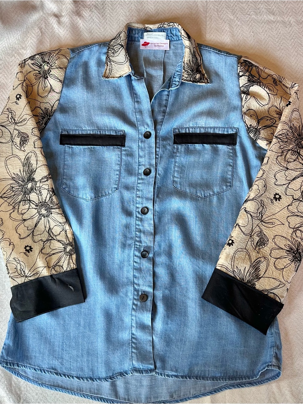 Upcycled Women’s Blue Denim Button-Up Blouse with Black and Cream Floral Sleeves